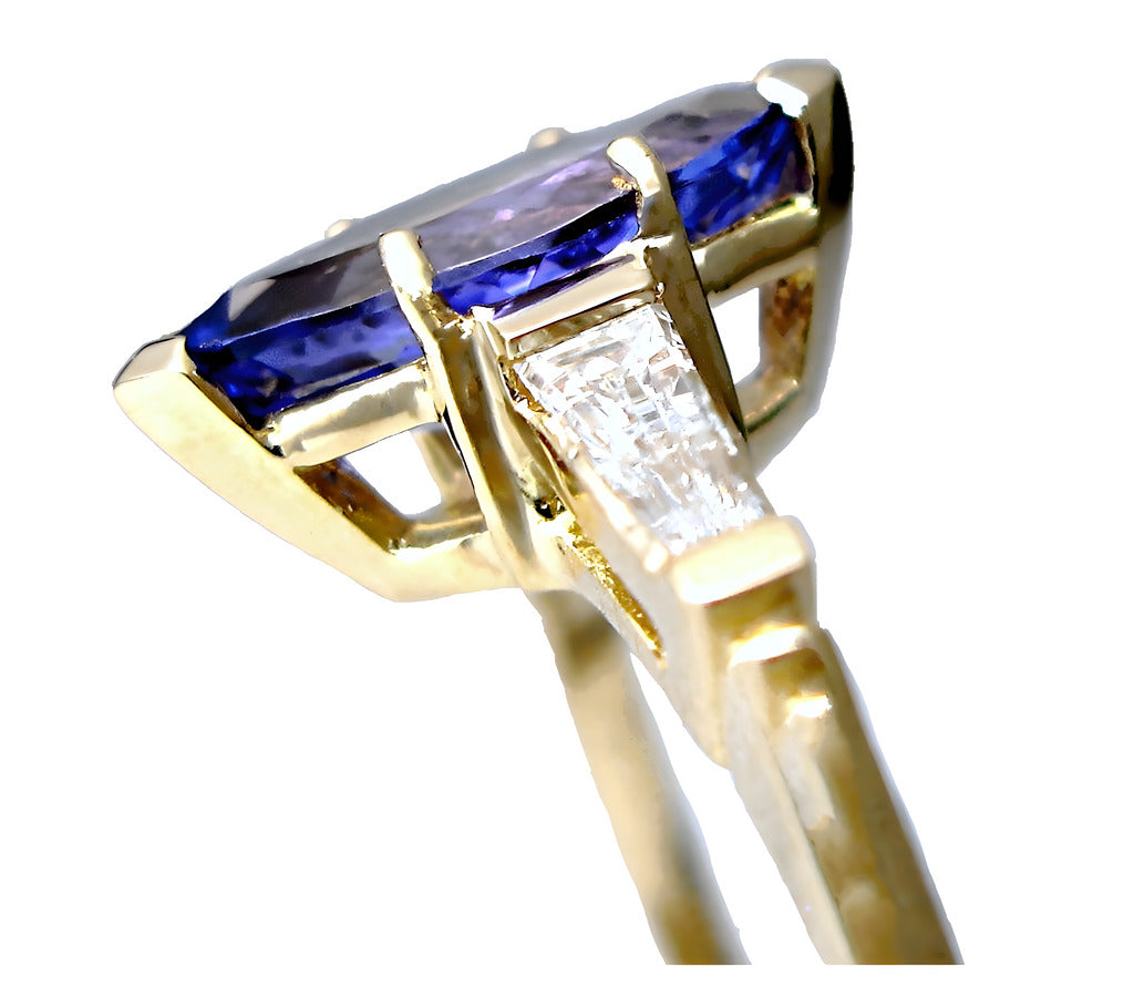 18k yellow gold Marquise Tanzanite and tapered baguette diamond solitaire ring, side view