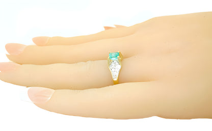 Emerald cut Emerald and diamond ring