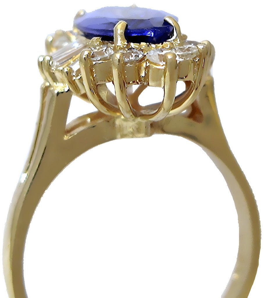 18k yellow gold Marques Tanzanite ring with round, and tapered baguette diamonds - In House Treasure