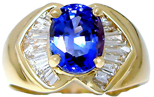 18k yellow gold Oval Tanzanite ring, with channel set Tapered Baguette diamonds - In House Treasure