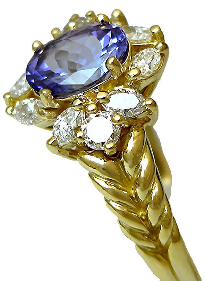 18k yellow gold Oval Tanzanite with marquise and round diamonds ring - In House Treasure
